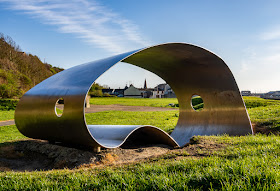 Photo of looking through a sculpture towards Maryport