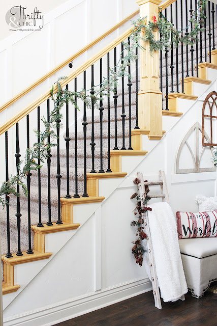 Entryway Christmas decorating ideas. Farmhouse Christmas Entryway decor. Board and batten entryway. Two story entryway ideas. Hanging garland on a banister or stairs.