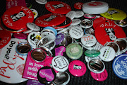 Nonbook swag, lots of buttons. Another book signing. (button swag)