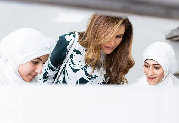 Queen Rania wore Manolo Blahnik BB 105 suede teal green shoes heels pumps. She carried Tod's mini bag. print green silk blouse