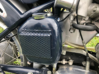 Cooling grate on oil tank of motorcycle.