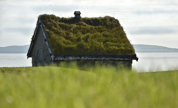 Old stone house with grass roof