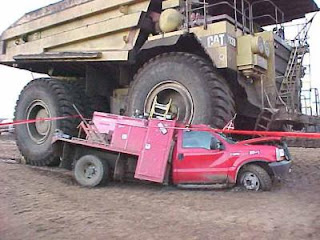 giat dump truck crushes car