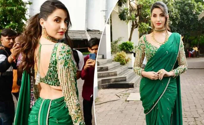 Nora Fatehi looks bold in green satin saree and embellished blouse