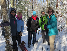 hikers on snowy trail