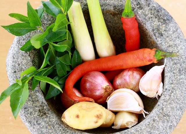 fresh herbs and spices for satay chicken curry