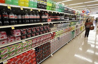 A shopper walks by the sodas aisle at a grocery store in Los Angeles April 7, 2011.<br />Credit: Reuters/Mario Anzuoni