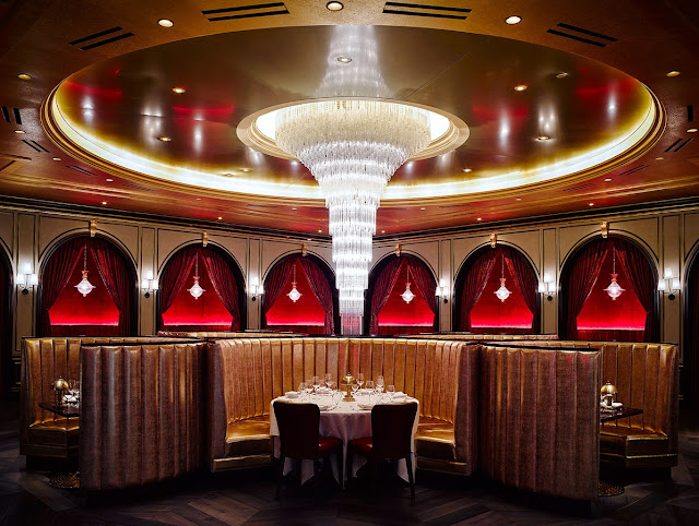 Dramatic private booth opera boxes massive chandelier Carbone Las Vegas dining room