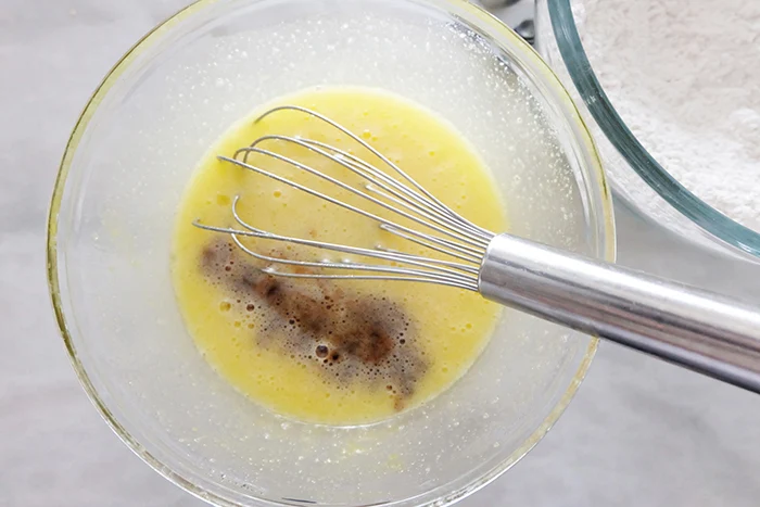 oil and vanilla mixed in with eggs and sugar