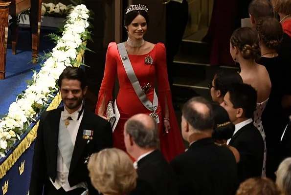 Queen Silvia, Prince Daniel, Prince Carl Philip. Princess Sofia wore a red dress. Crown Princess Victoria wore her mother's gown