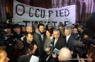 Occupy London protesters, with John Cooper QC, blue tie, and barrister Michael Paget, pink tie, at the High Court following news that the City of London Corporation has won its High Court bid to evict anti-capitalist protesters from outside St Paul's Cathedral.