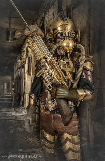Man dressed in steampunk costume made of leather and brass with a large gun made from trumpet parts