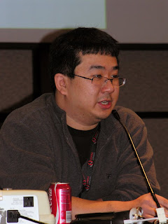 Lawrence Eng presenting a panel at Genericon XXIII