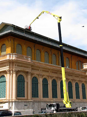 Cherry picker on the roof of the Central Market, Livorno