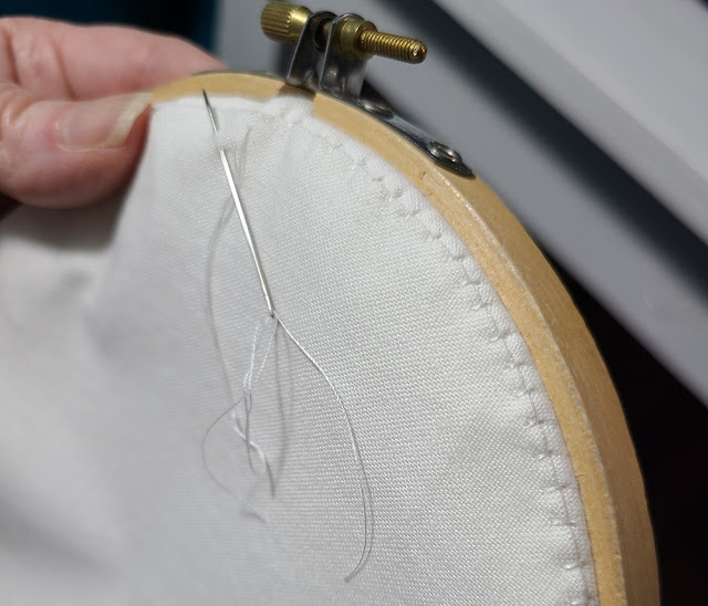 Finishing the back of a hoop with fabric | DevotedQuilter.com