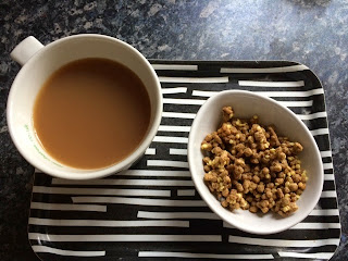 Cup of tea and bowl of all bran Golden Crunch cereal