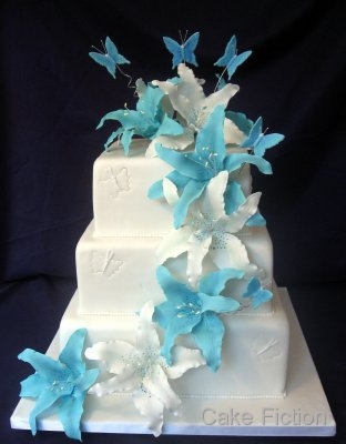 A new twist on a classic three tier square white wedding cake