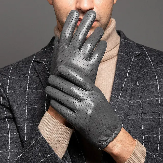 Tight grey leather gloves worn by man in grey wool blazer