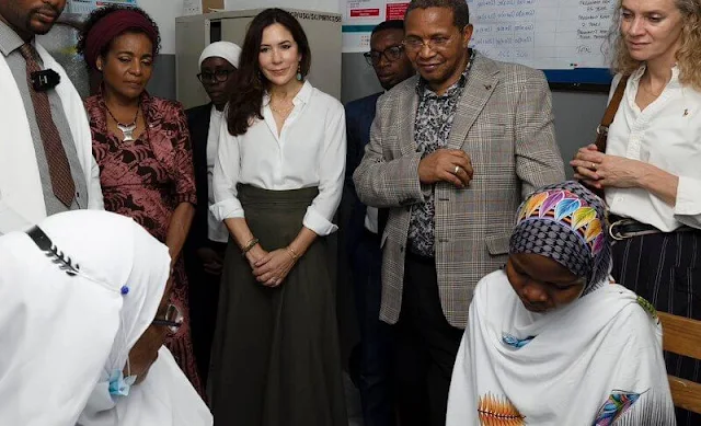 Crown Princess Mary wore a green rosehip midi skirt by Apiece Apart. Anonymous Copenhagen senara metallic gold goat flats