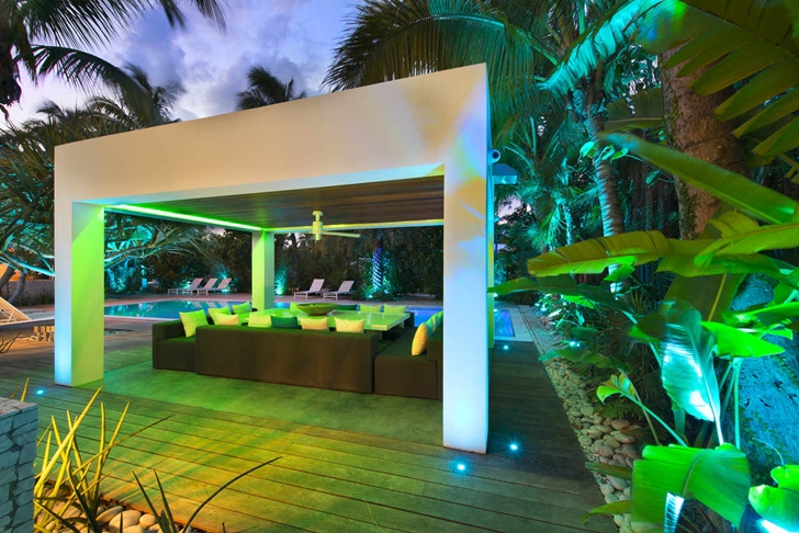 Covered terrace in Modern mansion in Miami at night
