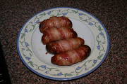 . process for you: http://realfood.tesco.com/recipes/pigsinblankets.html .