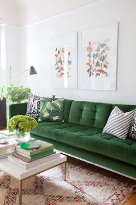 green velvet sofa, white walls 