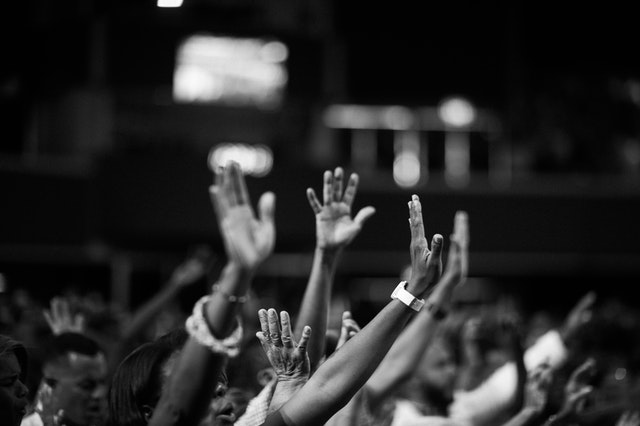 People raising their hands.