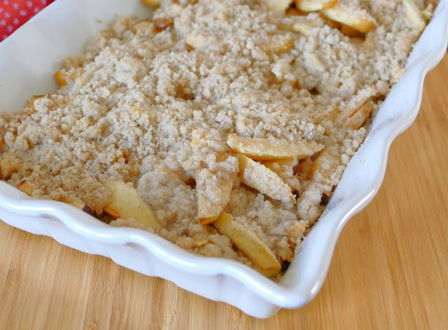 apple crisp in a white baking dish.