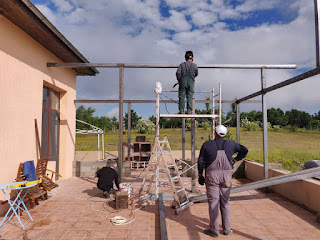 Bekir welds the second column in place