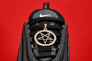 "Satan's shoes" are decorated with a Pentagram representing the devil and the words "Luke 10:18" (Note: the chapter in the Bible about Satan's fall from heaven).