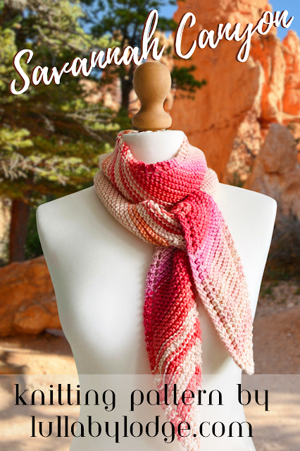 A Pinterest pin of a pretty knitted scarf, displayed on a mannaquin.