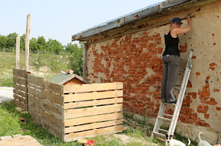 A holding a beam where I initially planned the roof to go up to