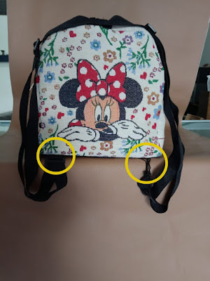 Fixing the child's bag strap 