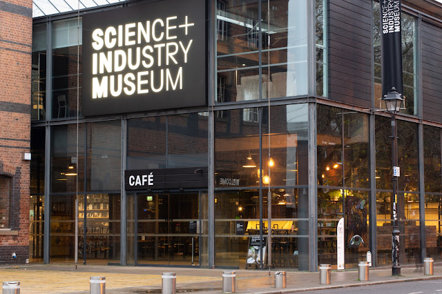 Modern glass front with text Science and Industry Museum