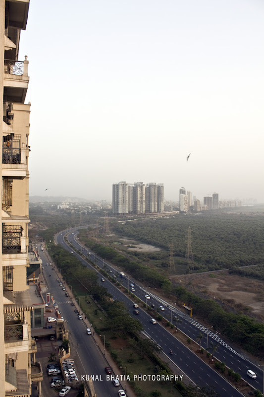 view of palm beach road from high rise skyscraper in sanpada, navi mumbai by mumbai photographer kunal bhatia