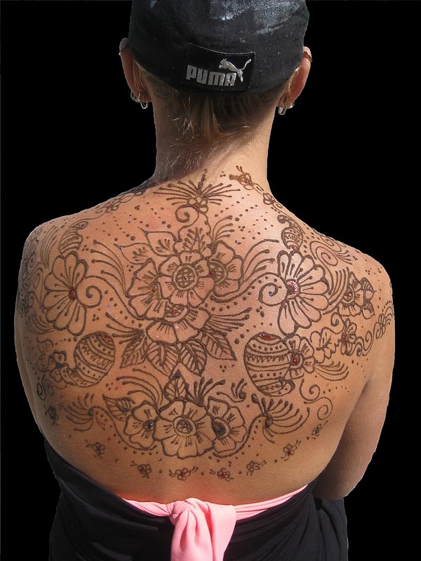 Henna Tattoo Design Henna tattoo design in a circular from the stomach into