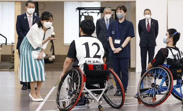 Princess Kako wore a short sleeve pleated white green striped dress and white wool jacket. She wore white leather pumps