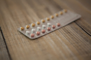 Pill packet on wooden table