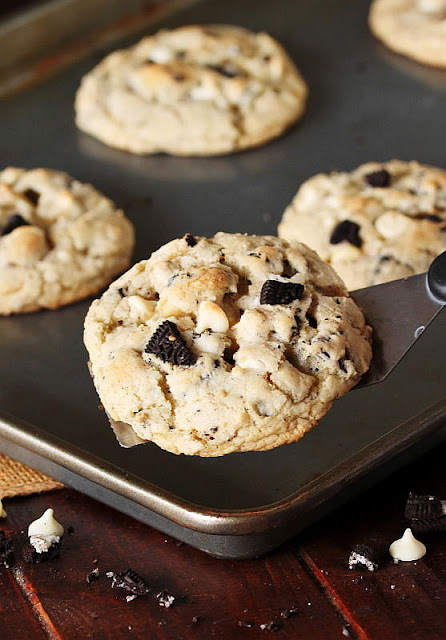 Removing Cookies & Cream Cookie from Pan with a Spatula Image