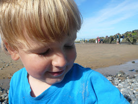 blue t-shirt on beach