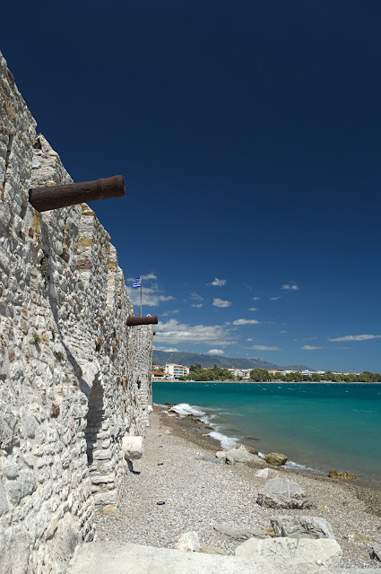 The stone wall of the port with the cannons in Nafpaktos, Greece.