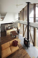 Origami House Design with A-Frame in an Old Village Surrounded by Mountains