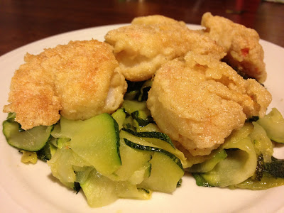 lemon king prawns on a bed of fried courgettes