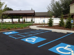 Moran UMC's parking lot with three accessible spaces and walkway.