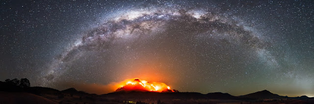 Panorama of the Milky Way Galaxy above Mt Barney during a massive fire