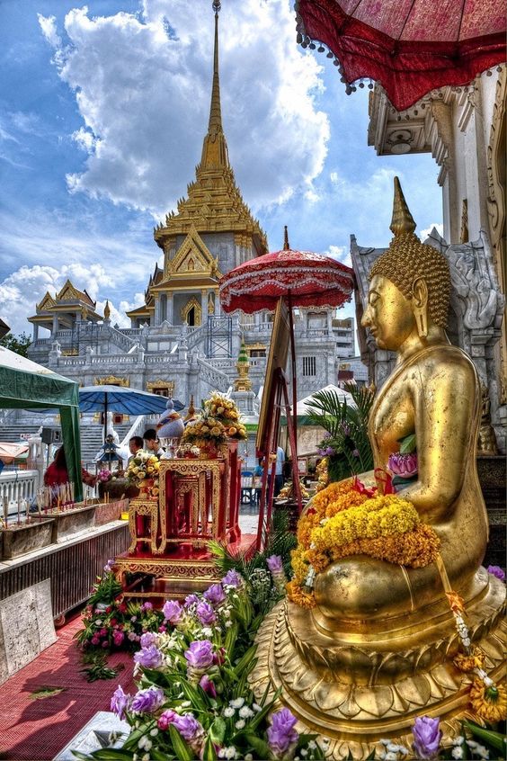 Futures - Buddha statue outside of Wat Traimit in Bangkok, Thailand.