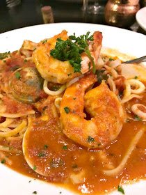 The Seafood Cioppino Style from Il Forno a Legna in McAllen, Texas is a gorgeous stew brimming with chunks of tender fish, mussels, clams, shrimp, & calamari in a flavorful tomato based broth. 