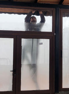 Halil working behind a frozen door