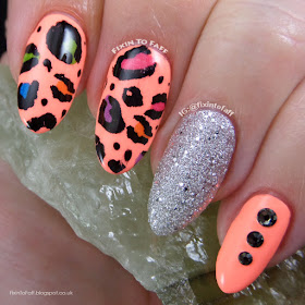 Birthday nail art of neon leopard print and black diamond swarovski crystal accents.