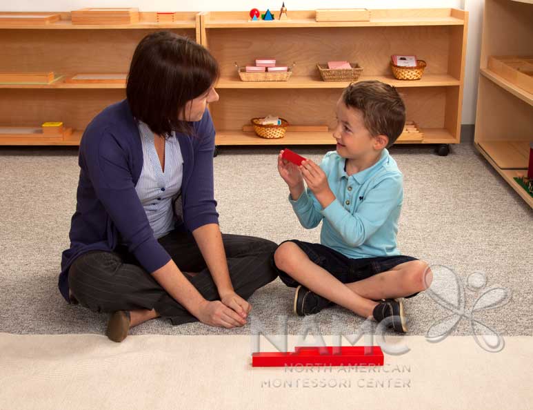 NAMC montessori following the child red rods at mat